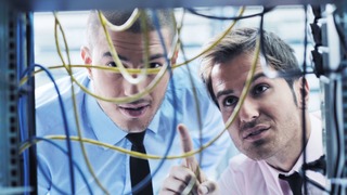 group of young business people it engineer in network server room solving problems and give help and support