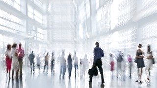 abstakt image of people in the lobby of a modern business center with a blurred background